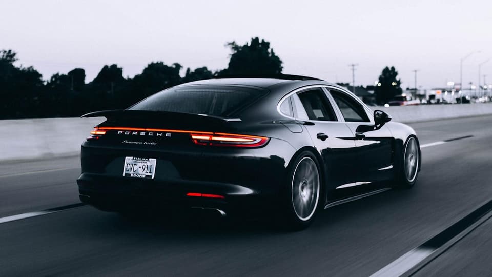 Stock photo: a dark sports car photographed at night